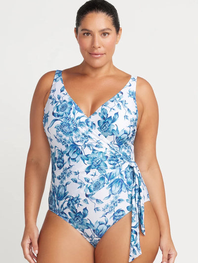 Front view of person in ArteSands Hayes One Piece Swimsuit in blue floral print