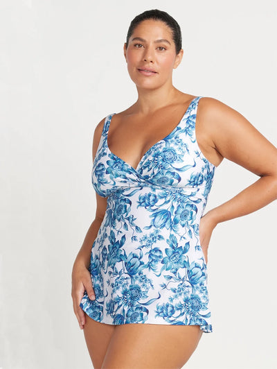 Side view of person in ArteSands Delacroix Swim Dress in blue floral print